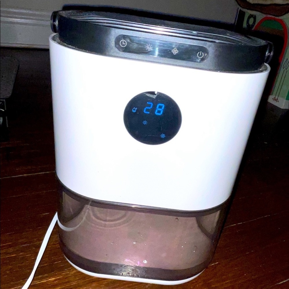 Dehumidifier used 2-3 months like new, portable
& ultra quiet 77.5 oz lights up